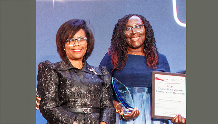 Prof Veronica Ngole-Jeme receiving the Chancellor's Award_banner.jpg
